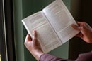 illustration-lenten-study-2015_(2) A man reads from Lenten study guide, 'Renegade Gospel: The Rebel Jesus' by Mike Slaughter.  Photo illustration by Kathleen Barry, United Methodist Communications.