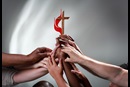 hands-cross-flame-unity Photo illustration by Kathleen Barry, United Methodist Communications.