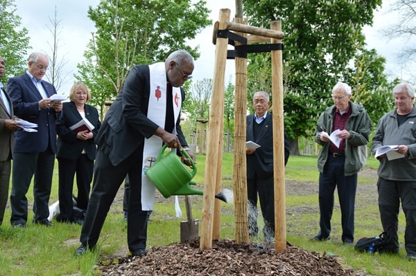 planting-lutheran-history-tour Bishops, waters a newly planted tree in the Luther Garden in Wittenberg, Germany, in preparation for the 500th anniversary of the Protestant Reformation in October 2017. The Lutheran World Federation invited churches around the globe to plant a tree in the garden and another in their area in advance of the event. File photo by Klaus Ulrich Ruof.