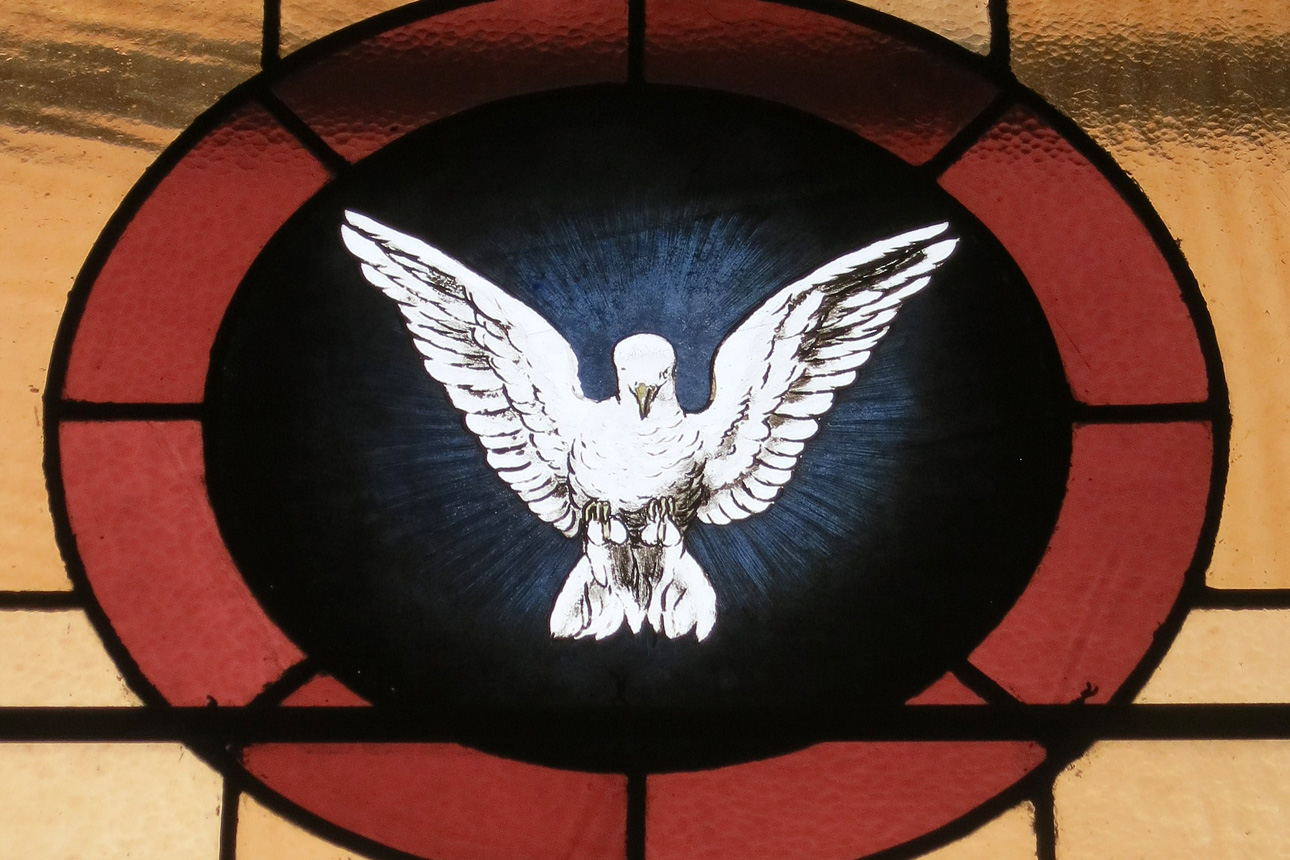 Stained glass window of the Holy Spirit as a dove from the Church of the Atonement in Crooksville, Ohio. Photo by Nheyob, courtesy of Wikimedia Commons.