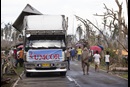 Community members walk past a food distribution site for the United Methodist Committee on Relief following Typhoon Haiyan in Dagami, Philippines. Photo by Mike DuBose, UMNS Community members walk past a food distribution site for the United Methodist Committee on Relief following Typhoon Haiyan in Dagami, Philippines. Photo by Mike DuBose, UM News.