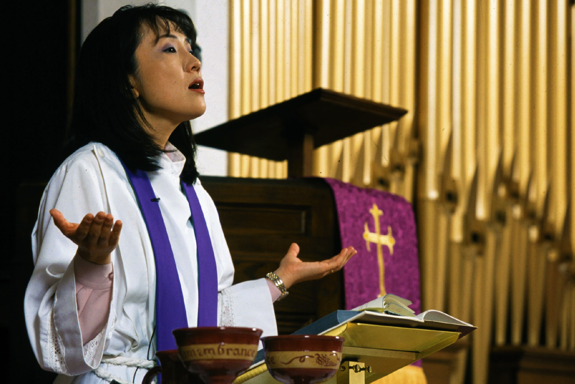 Who is in charge of worship in the local church?