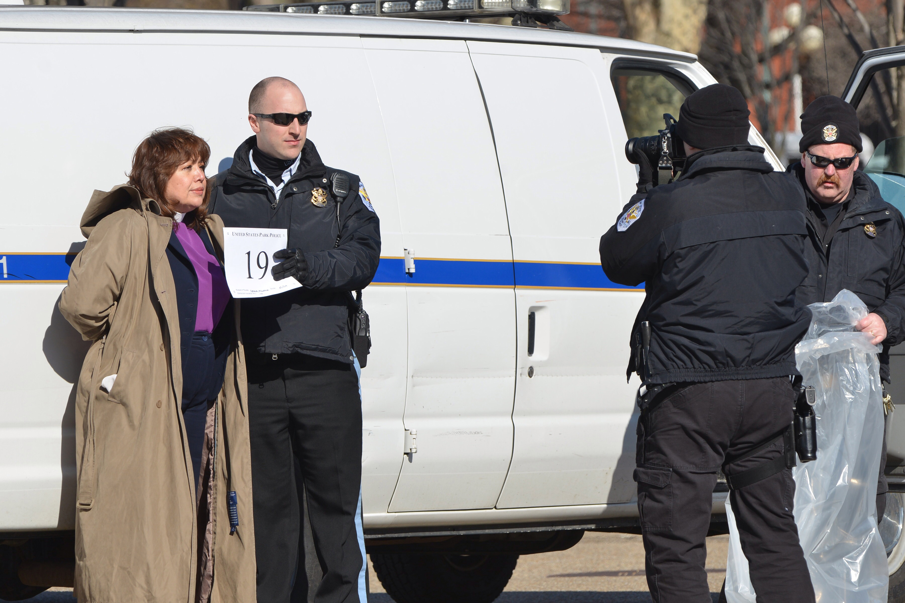 Police arrest United Methodist Bishop Minerva Carcaño after a prayer vigil on Feb. 17, 2014, at the White House in support of progress on immigration reform and an end to deportations. 
