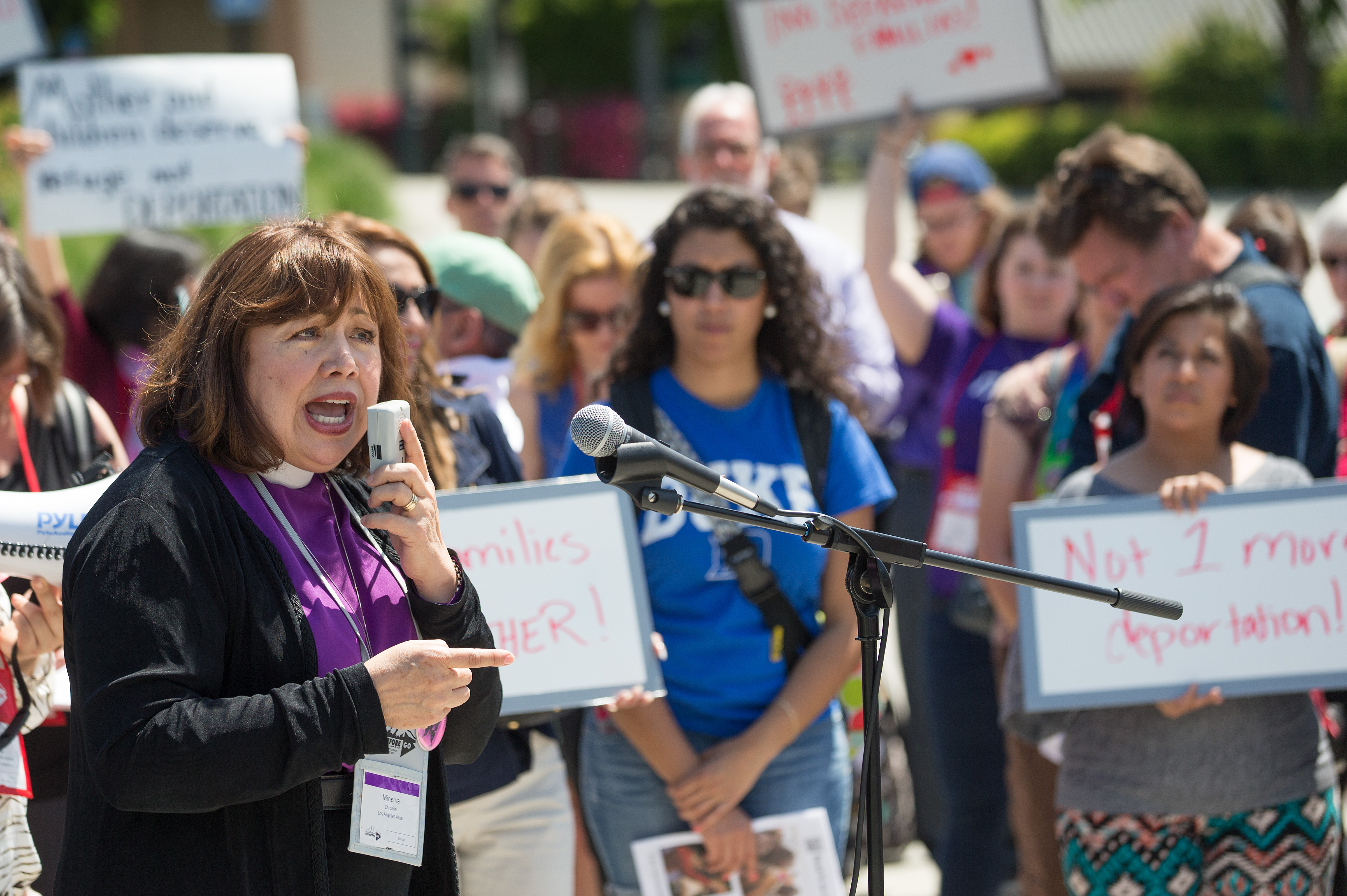 Bishop Minerva Carcaño addresses a rally of Methodists in support of immigration reform rally at the Convention Center Plaza outside the 2016 United Methodist General Conference in Portland, Ore. 