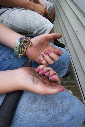 A young ladies displays her pink fingernails and dirty hands during a SOWER Work Mission project. Photo courtesy of the Rev. Dawn Livingston. 