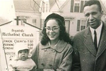 The Rev. Gilbert Caldwell poses with his wife Grace, and sons Dale and Paul in front of Bryantville United Methodist Church.