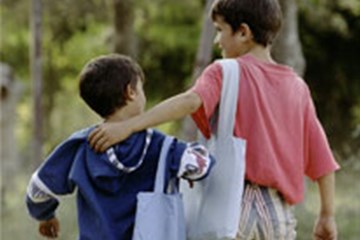 Two students from Yugoslavia walk home together. Photo by Mike DuBose, United Methodist Communications.