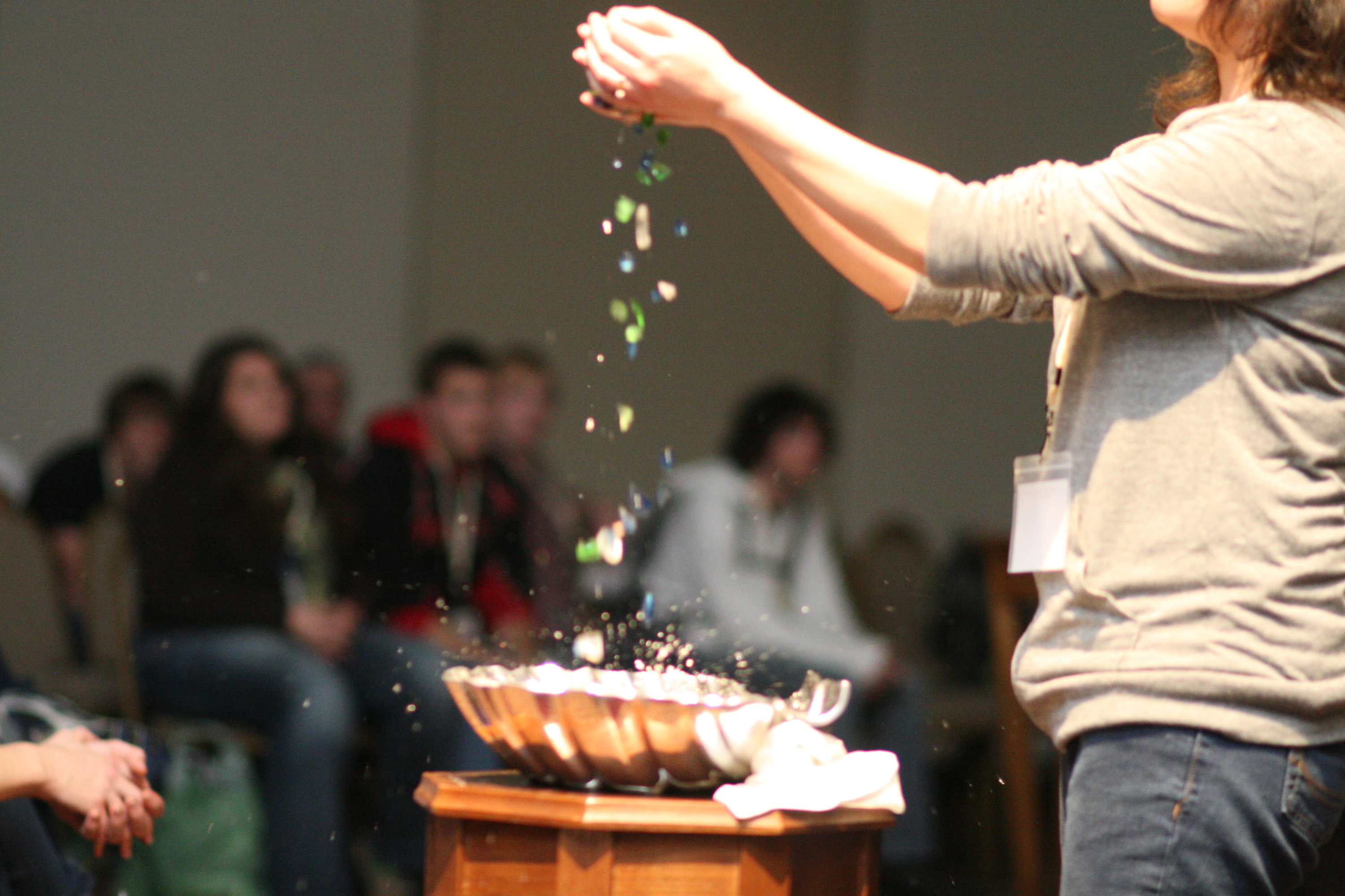 The Rev. April Casperson leads participants in baptism reaffirmation at Exploration 2011,  in St. Louis, Missouri. Photo by Kathy L. Gilbert, United Methodist News Service.
