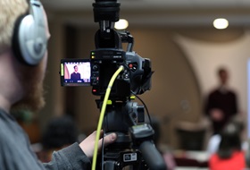 Andrew Jensen video records David Kinnaman, president of the Barna Group, as he leads a presentation called "The Seeker Context" at United Methodist Communications. Photo by Kathleen Barry, UM News.