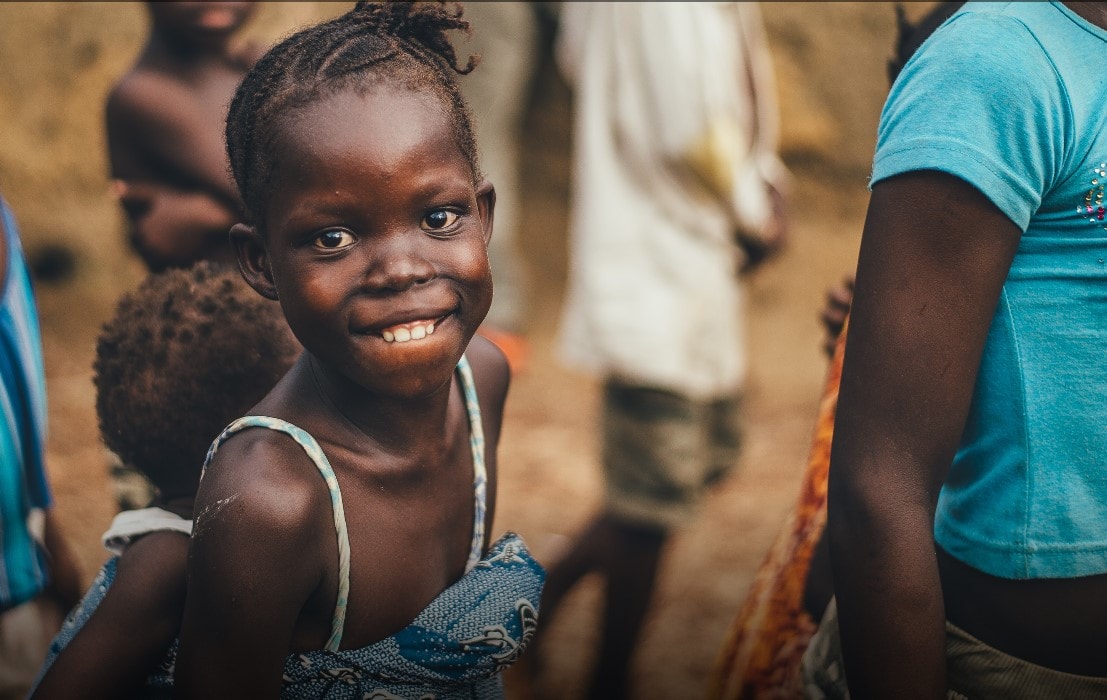 Child smiling to the camera UMCOR