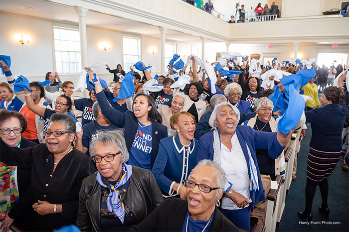 Stand with Bennett supporters celebrate upon hearing that the College has raised $8.2 million