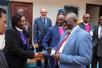 Western Pennsylvania Bishop Cynthia Moore-Koikoi shakes hands with Gangano Mangokube, ambassador from the Democratic Republic of Congo, during a November mission trip to the Central Africa Republic. 