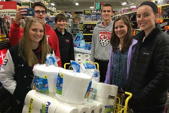 Kirstin King poses with other volunteers while shopping.