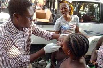 Dr. Godfrey Ogbu provides medical care for patients who were displaced by fighting at a camp for displaced people in Numan. Photo by Ande Emmanuel, United Methodist Communications.