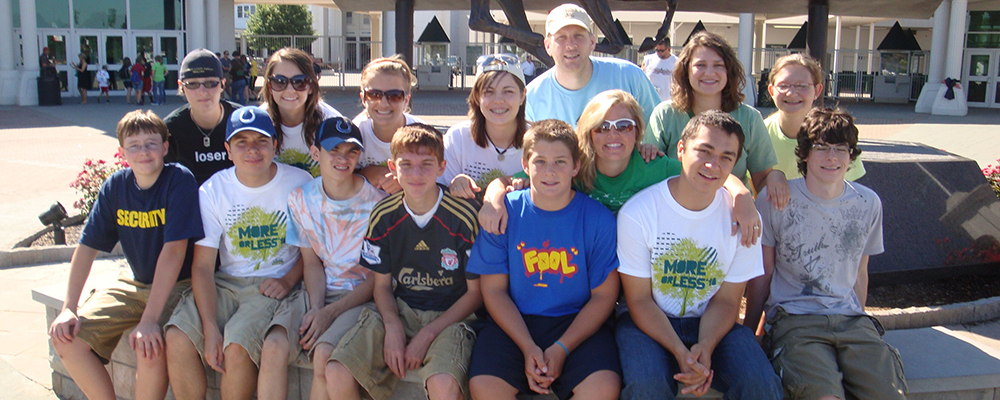 Stock photo of youth and teachers around fountain