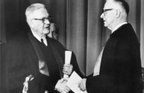 Evangelical United Brethren Church Bishop Reuben H. Mueller (left) and Methodist Bishop Lloyd C. Wicke join hands on April 23, 1968. Photo courtesy of archives of United Methodist Communications.