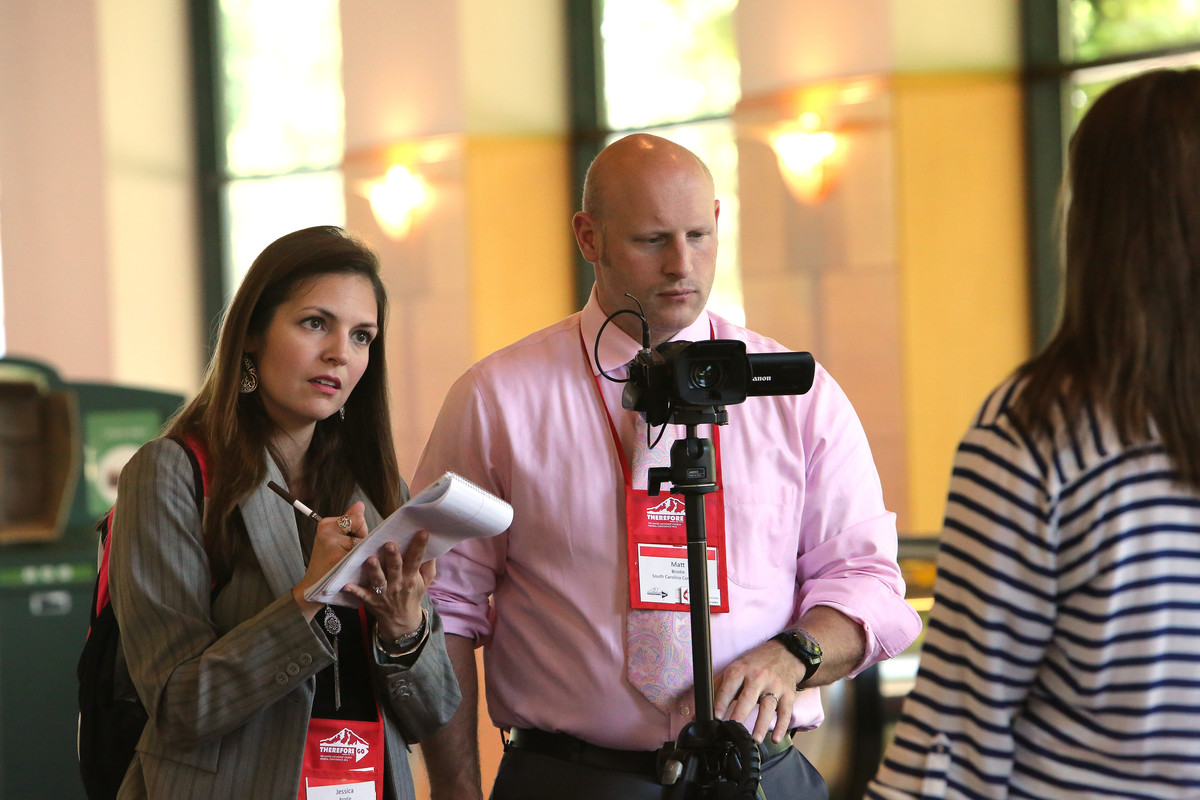 South Carolina communicators, Jessica and Matt Brodie, interview Elizabeth Murray, a page and marshall during the 2016 United Methodist General Conference in Portland, Ore.