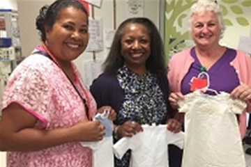 Pauline Lindo and the Rev. Brenda Presha deliver Angel Gowns to an Atlanta area hospital.