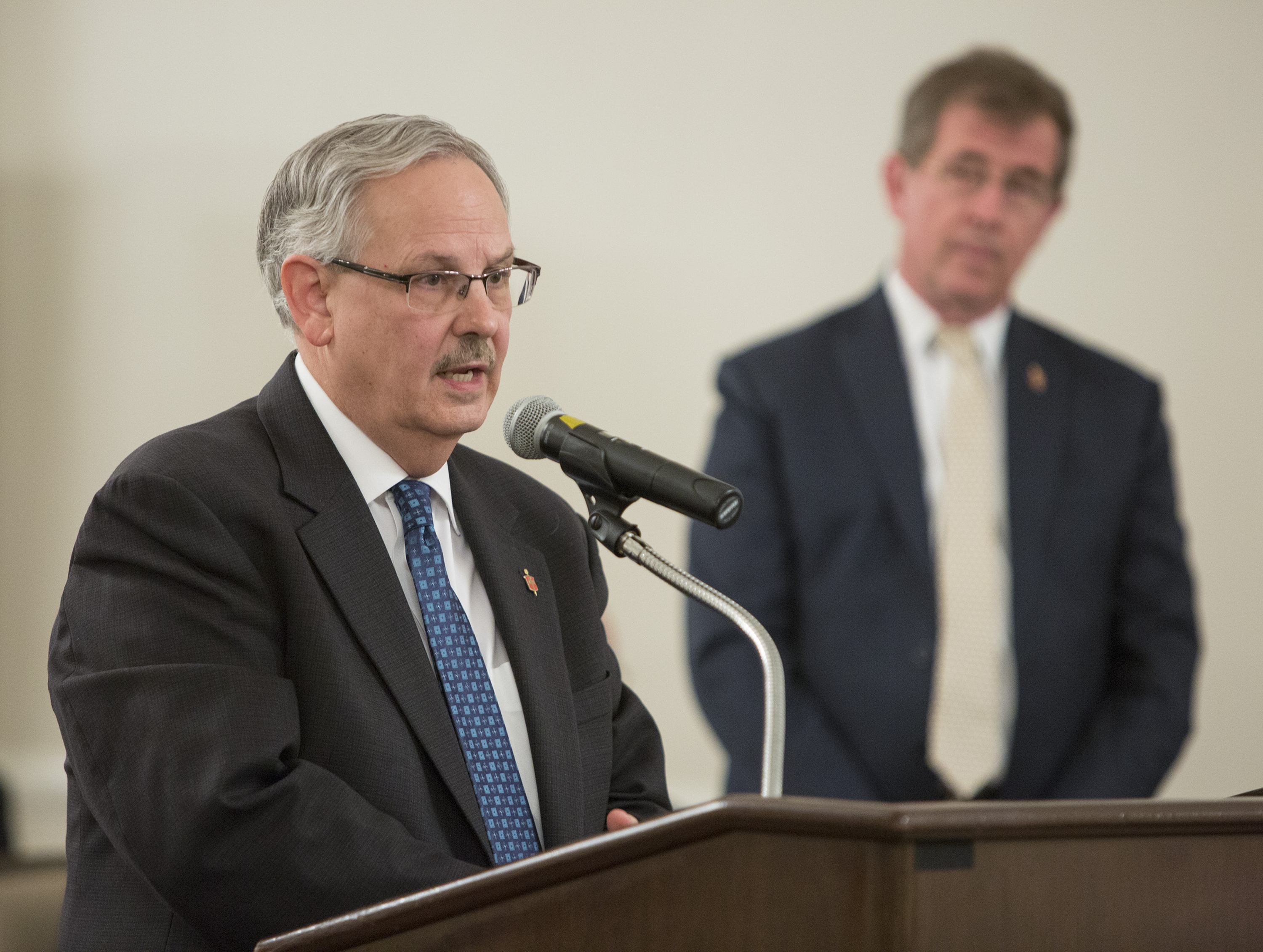 Bishop Bruce Ough (left) speaks during the oral hearing of the Judicial Council meeting on May 22, 2018. Also pictured (right), Bishop Scott J. Jones of the Texas Conference. Photo by Kathleen Barry, UMNS.