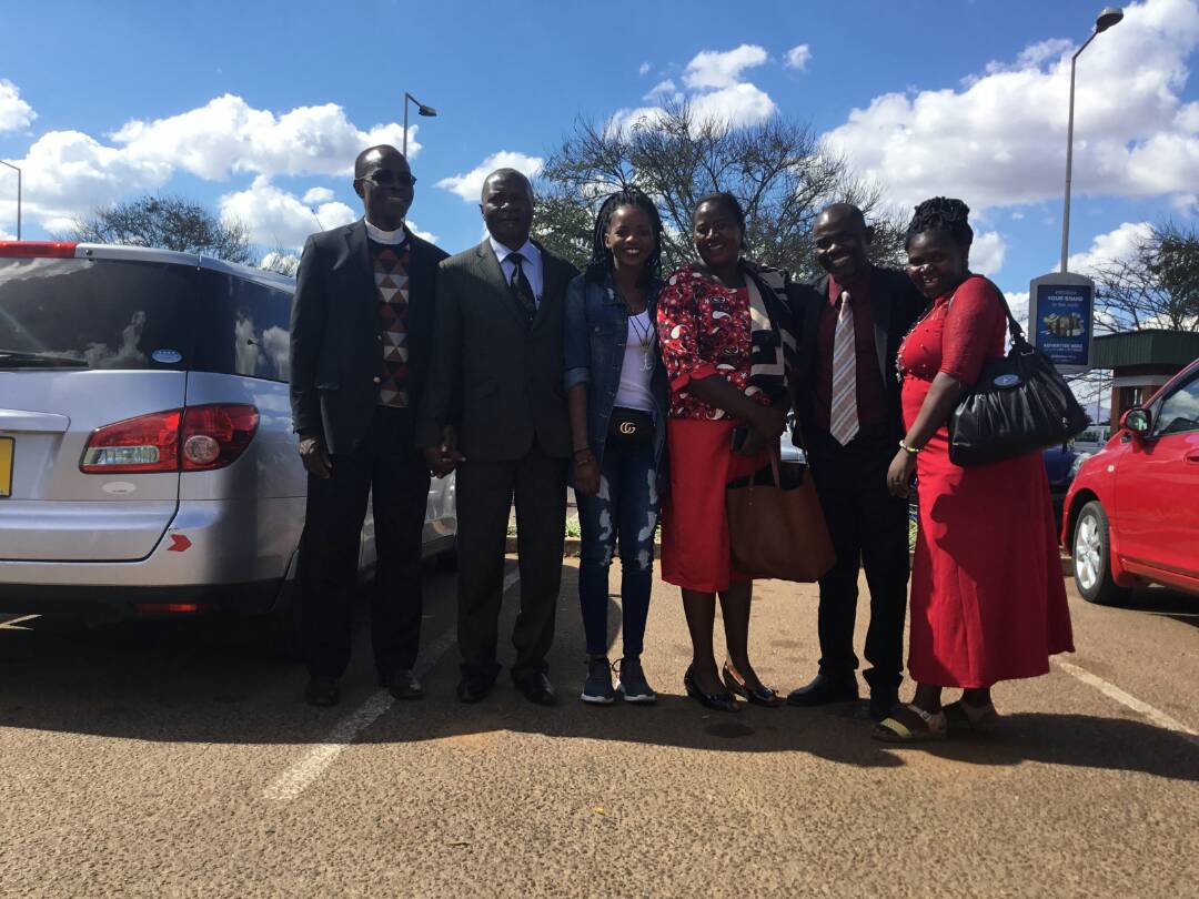 Family and fellow United Methodist members celebrate the return of Malawian Miracle Osman. Pictured left to right: Rev. Daniel Mhone (Conference Superintendent), Pastor Kalondola Nkhata (Miracle's Father), Malawian Miracle Osman, Mrs. Nkhta (Miracle's mother), Rev. Kambona (District Superintendents for Southern District), Mrs. Kambona. Photo courtesy of Christopher Hamera