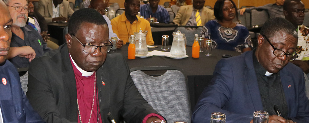 Bishop Kasap Owan from the South Congo Episcopal area (center) and delegates listen during the United Methodist Board of Global Ministries/United Methodist Committee on Relief agricultural summit in Johannesburg. 