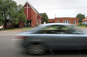 This car passes West Nashville United Methodist Church, but many Christians are making time in their busy schedules to work on their spiritual lives with a small group. File photo by Kathleen Barry, United Methodist Communications.