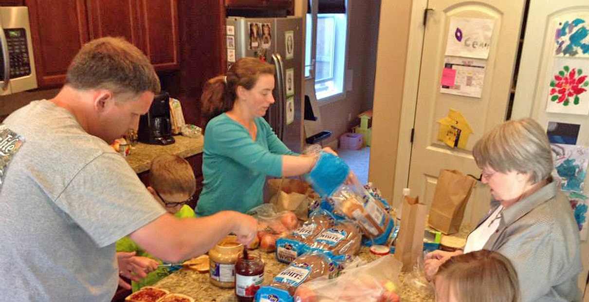 Serving their community, through actions like preparing sandwiches to give to people in need, is an important part of Zacc's House, a network of faith communities in Portland, Oregon. Photo courtesy the Rev. Beth Estock