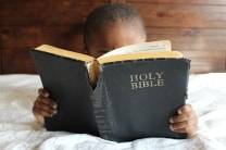 Read a scripture passage. Discuss some questions. Pray together. Find ways your family can help one another be more holy. Image by Sara Schork, United Methodist Communications.