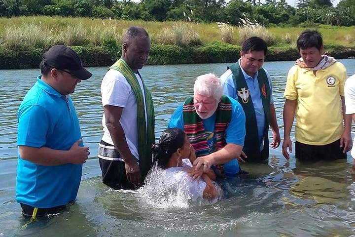 United Methodist pastors from North Georgia join in baptizing 47 people in a river in Angat, Philippines. The North Georgia Conference partners with the Bridges Philippines project. Photo by the Rev. Joey Galinato. 