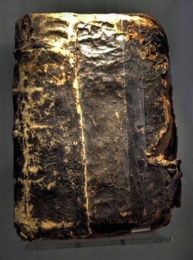 A charred Bible found under rubble on the grounds of the rectory at Epworth may have belonged to the Wesleys and survived the fire. Photo by Joe Iovino, United Methodist Communications.