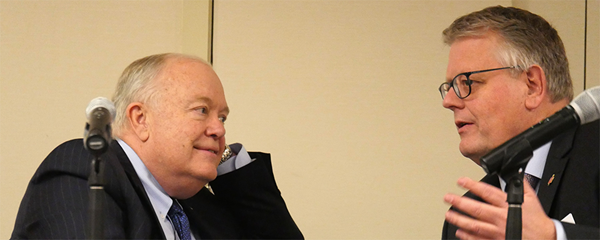 Bishops Mike McKee and Christian Alsted discuss the process for voting on budget proposals during a joint meeting of the General Council on Finance and Administration board and Connectional Table in Nashville, Tenn. McKee is president of the finance agency board and Alsted is chair of the Connectional Table.