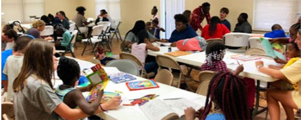 Senior Konner Smith tutors a child from Butler Homes.