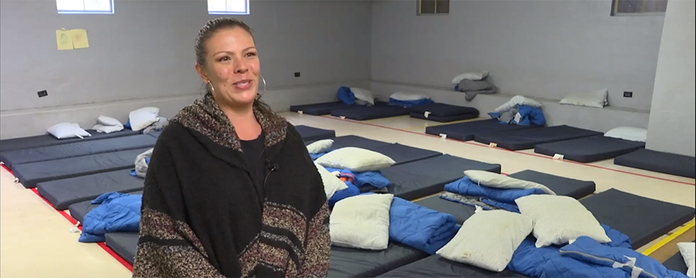 Jennifer Covarrubias from Rogue Retreat, stands in front of sleeping mats that 141 homeless people used as a home during the Winter months at the Kelly Shelter located in the basement of First United Methodist Church, Medford, OR.