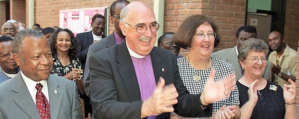 Bishop J. Lawrence McCleskey stands with staff and guests at AU.  Bishop J. Lawrence McCleskey stands with staff and guests at AU. Courtesy photo.