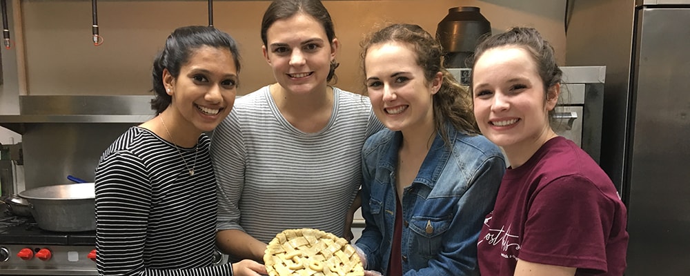 Emma Storer (far right) poses fellow students after baking a delicious pie at Washington University. Courtesy photo