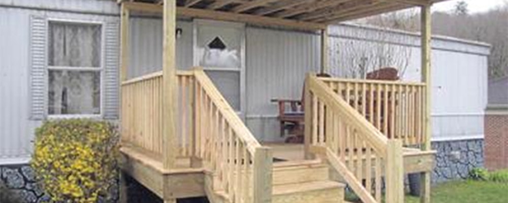 Volunteers with a Georgia-based mission group and other local volunteers wrapped up work on Chi Chi Pauley’s new porch on Thursday. Photo: Jeffrey Simmons/Bland County Messenger