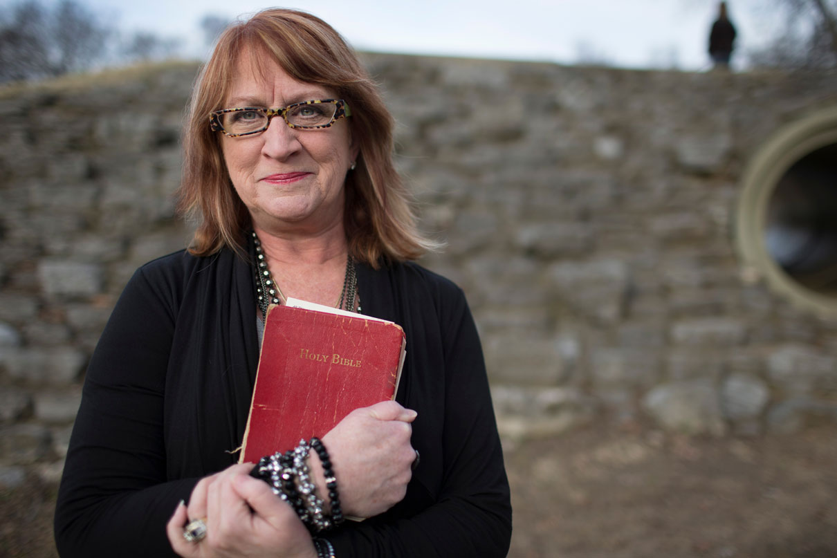 Kathy Dozier holds her high school Bible, which was found and returned to her by her nephew. Photo by Mike DuBose, United Methodist Communications.