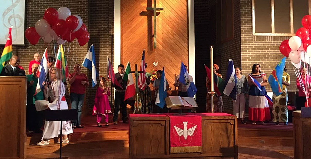 Members of Central United Methodist Church in Charlotte, NC celebrate with a Parade of Members' Nations Flags ceremony. Hispanic laypeople at North Carolina church are leading programs that unify the church membership. Photo courtesy of Central United Methodist Church.