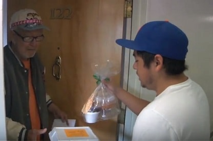 A teen from Centenary United Methodist delivers a Thanksgiving meal 