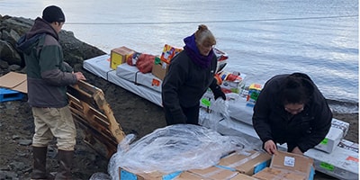 Food and supplies unloaded on the shore for distribution to Chignik villages on the Aleutian Islands, Alaska. Photo: Courtesy Chignik Intertribal Council.