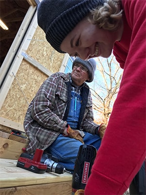 Anna Teekell helping to build steps to a home. Courtesy photo.