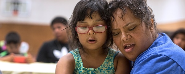 Danielle Lopez receives a hug from daughter Denise following the singing of Amazing Grace in Cherokee, North Carolina. Danielle Lopez receives a hug from daughter Denise following the singing of Amazing Grace in Cherokee, North Carolina.