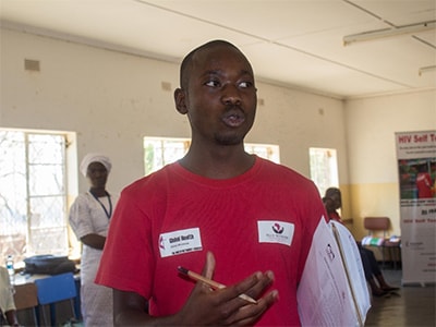 A community awareness meeting in Malawi offers information on what HIV services are available and how to access them. Photo: WorldHope Corps.