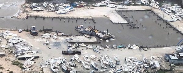 An aerial view shows damage to a marina after Hurricane Dorian pummeled the Bahamas for several days beginning Sept.1. The Coast Guard supported the Bahamian National Emergency Management Agency and the Royal Bahamian Defense Force, who led search and rescue efforts in the Bahamas. Photo by Hunter Medley, U.S. Coast Guard, courtesy of Coast Guard Air Station Clearwater. An aerial view shows damage to a marina after Hurricane Dorian pummeled the Bahamas for several days beginning Sept.1. The Coast Guard supported the Bahamian National Emergency Management Agency and the Royal Bahamian Defense Force, who led search and rescue efforts in the Bahamas. Photo by Hunter Medley, U.S. Coast Guard, courtesy of Coast Guard Air Station Clearwater.