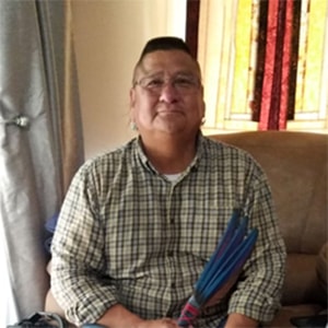 Rev Calvin Hill sitting at home. Courtesy photo.