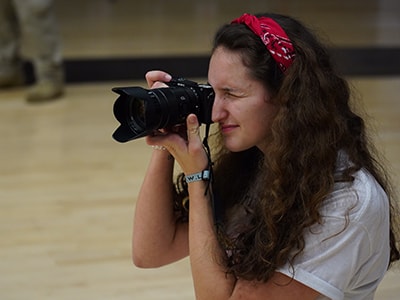 Lynch preparing taking photo an event. Courtesy photo.