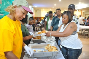 We are called to continue in ministry as we wait. File photo of lunch distribution by Ames Memorial United Methodist Church. Photo by Jay Mallin for the Baltimore-Washington Conference.