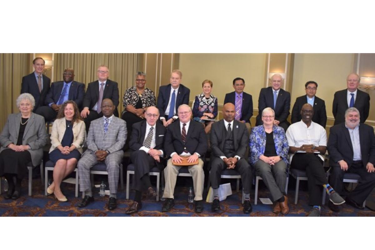 Members of the negotiating team of United Methodist bishops and UMC other leaders pose for a photo in Tampa, Fla., in January after discussing details of the Protocol of Reconciliation & Grace Through Separation. The protocol was achieved with help of mediator Kenneth Feinberg and his team.
