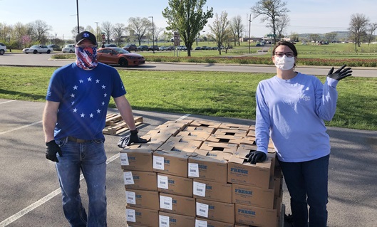 Over 30,000 pounds of food provided by Feed America First is distributed to those in need in Wilson County, Tenn. Lebanon First United Methodist Church in Lebanon, Tenn. was able to restock its food pantry as well as help provide a week’s worth of food to over 350 families. Pictured are John Stephens and Laura Headley, members of Lebanon First United Methodist Church. Photo by the Rev. Ryan Bennett.