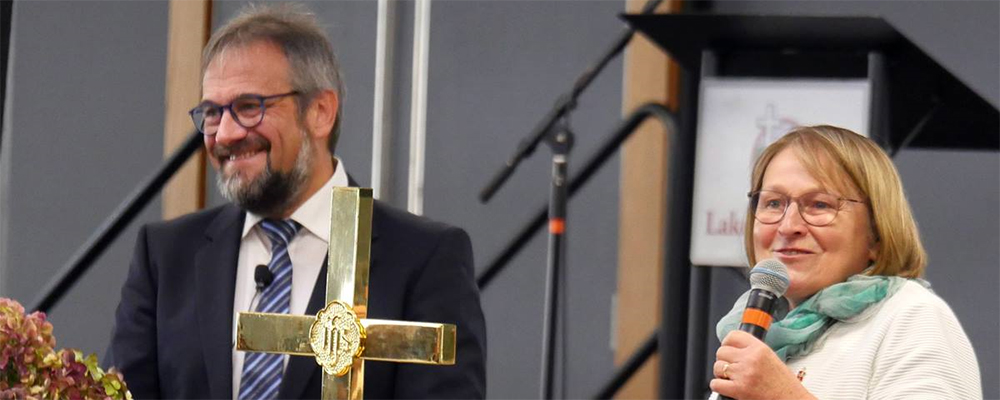 Bishops Harald Rückert and Rosemarie Wenner of Germany recount the role the Christian faith played in the fall of the Berlin Wall 30 years ago. During the Council of Bishops meeting in Lake Junaluska, N.C., bishops were challenged to remove barriers of various kinds. Photo by Heather Hahn, UM News
